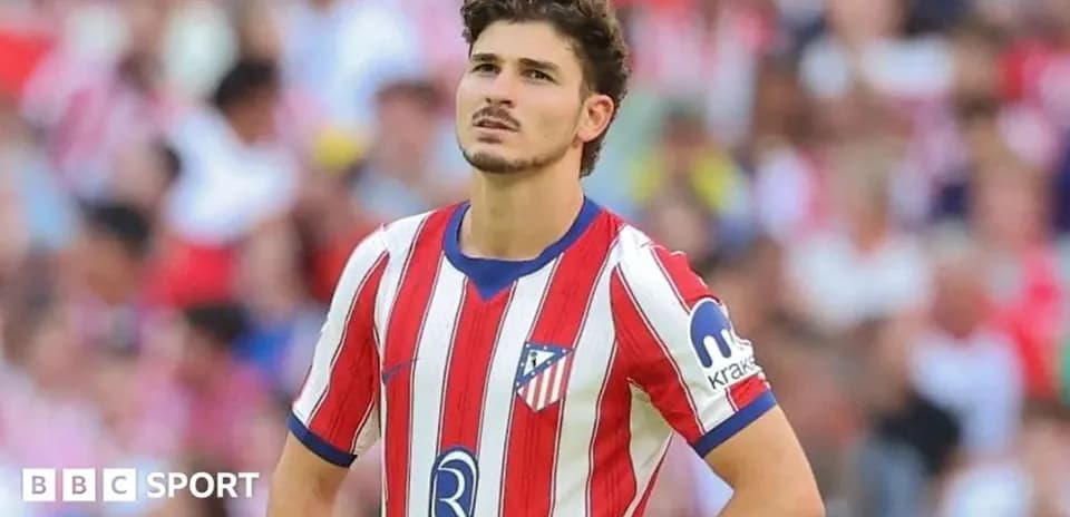 Atletico Madrid player looking concerned on field