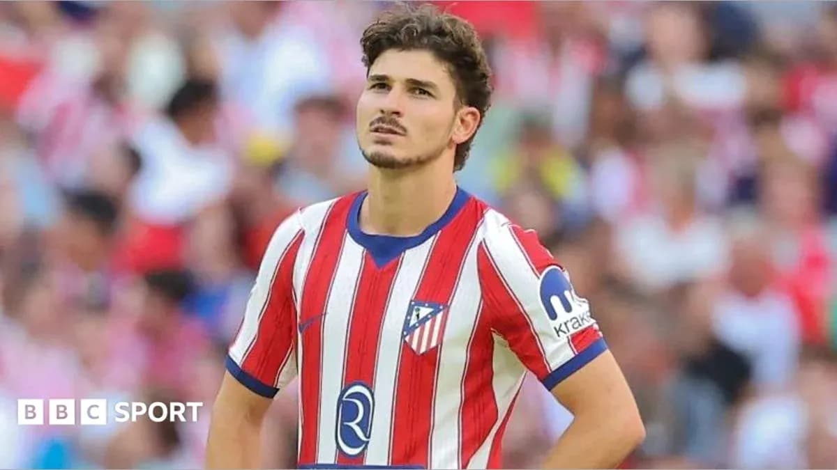 Atletico Madrid player looking concerned on field