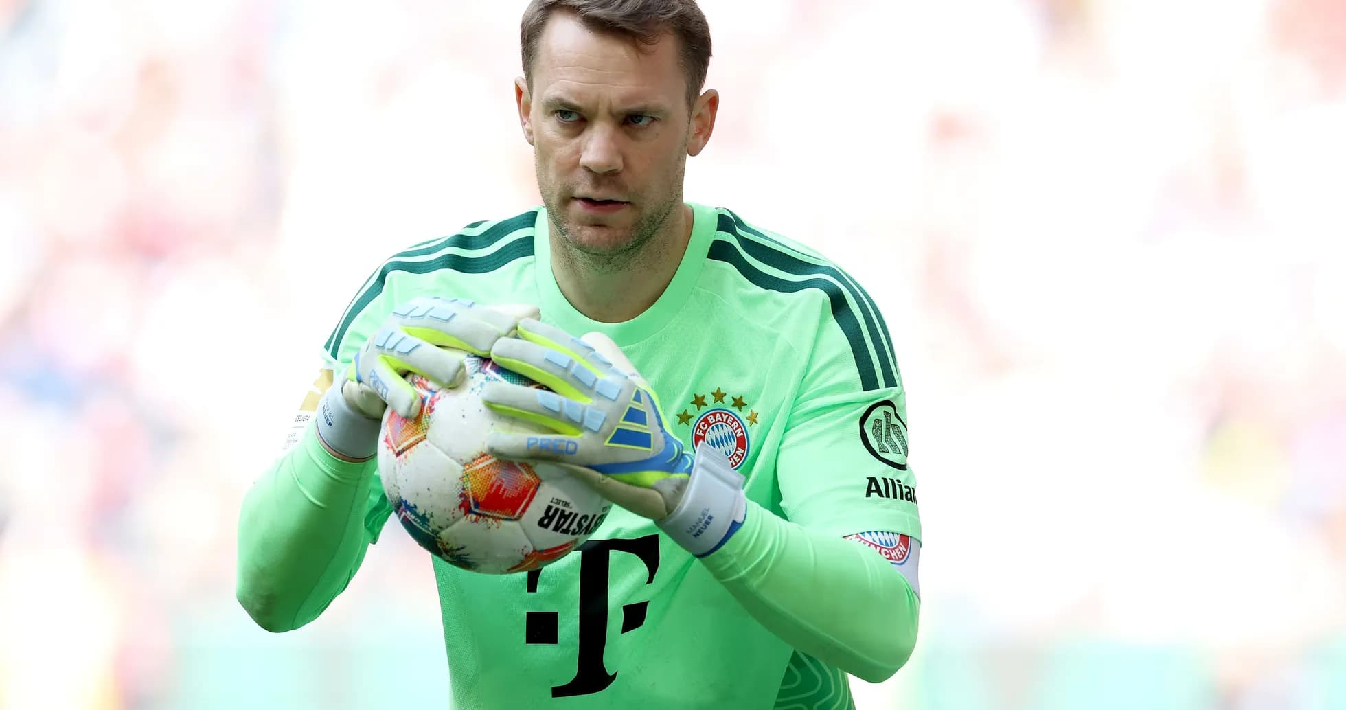 Goalkeeper holding ball during match preparation