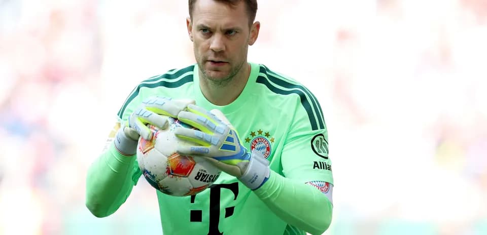 Goalkeeper holding ball during match preparation