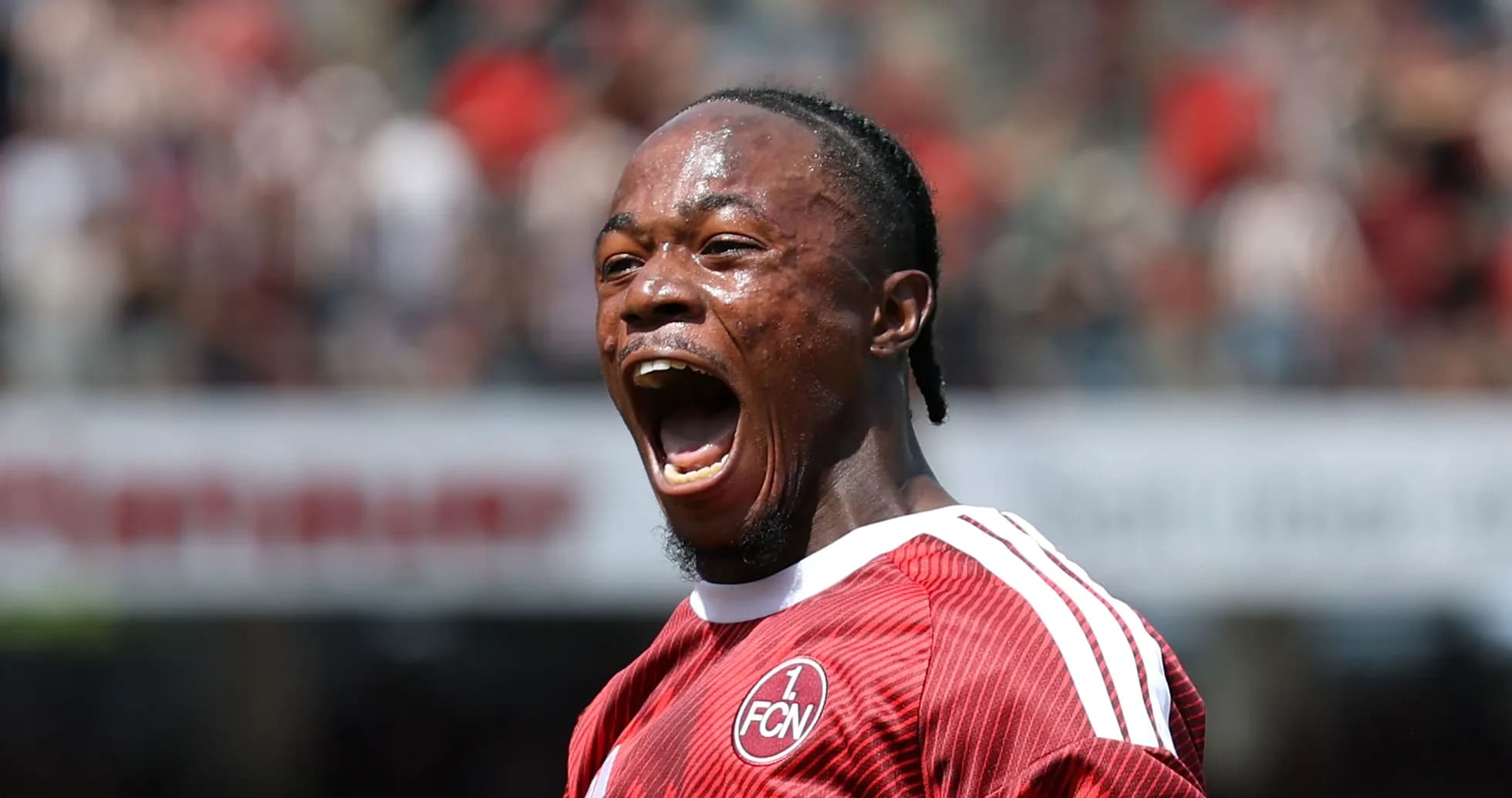 Player celebrating with a loud shout on field