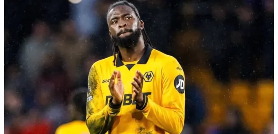 Player applauding fans in Wolves jersey at stadium