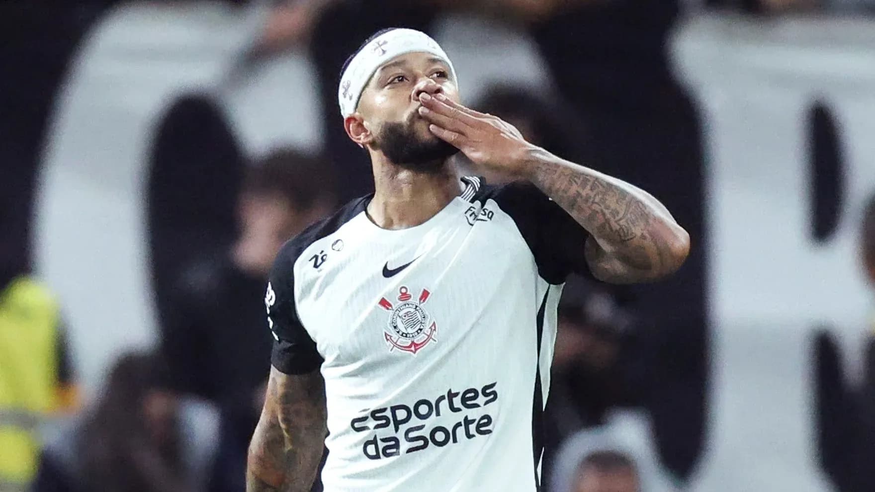 Player celebrating and blowing a kiss after scoring