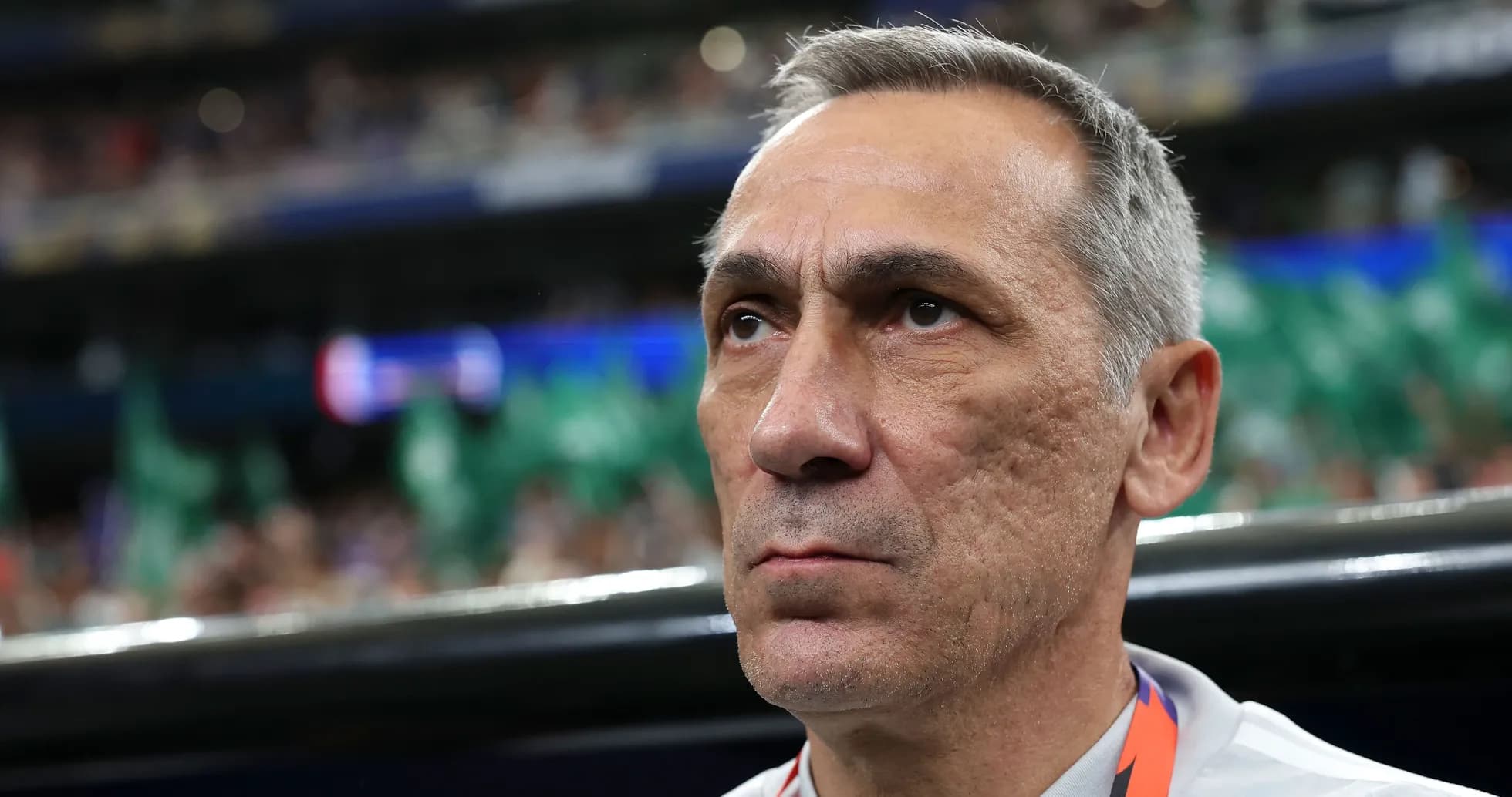 Coach observing match from the sidelines