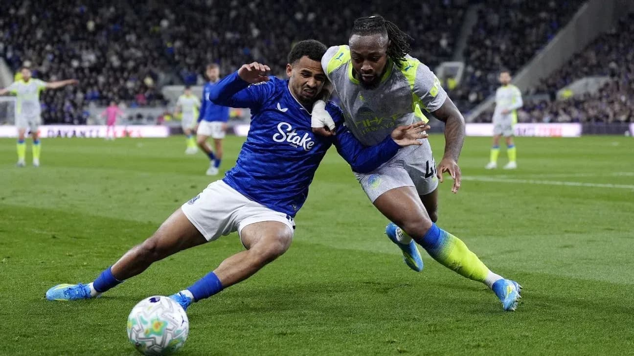 Two players competing for the ball on the field