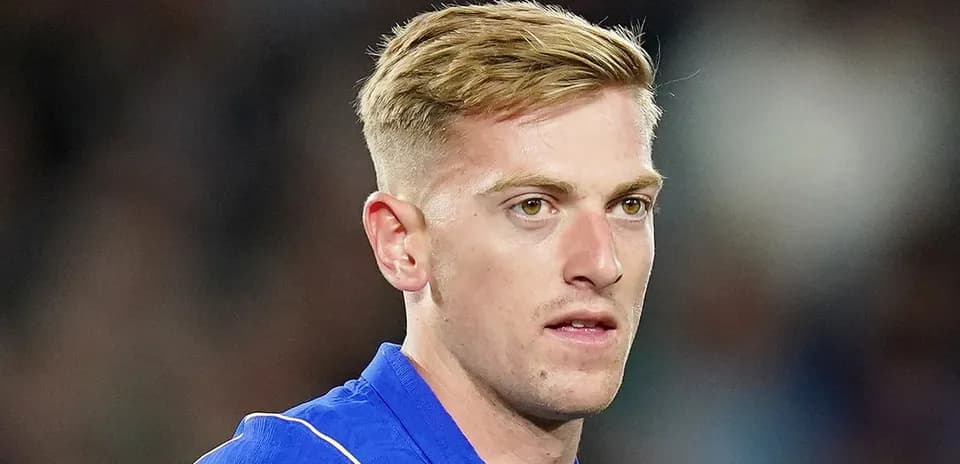 Football player in blue jersey during match