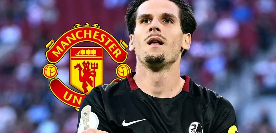 Player in black jersey with Manchester United logo background