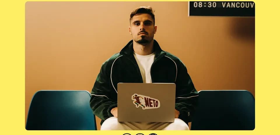 Person sitting with laptop in casual attire