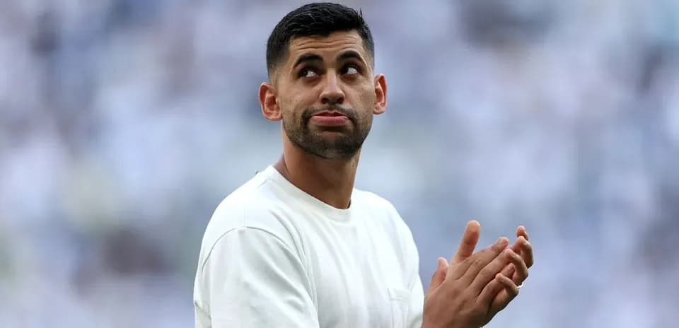 Player clapping while looking up in stadium