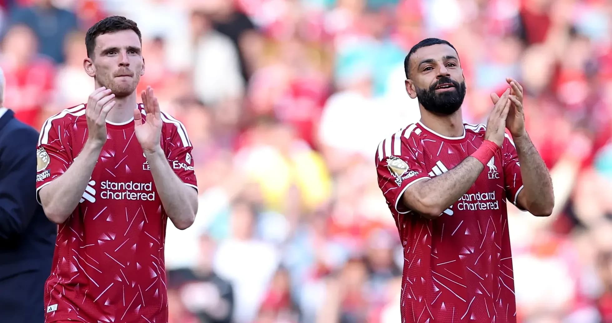 Liverpool players applauding fans after match