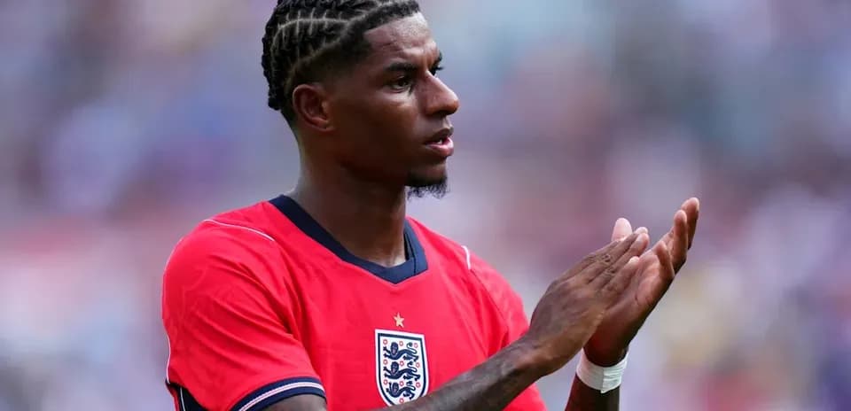 Player applauding while wearing England jersey