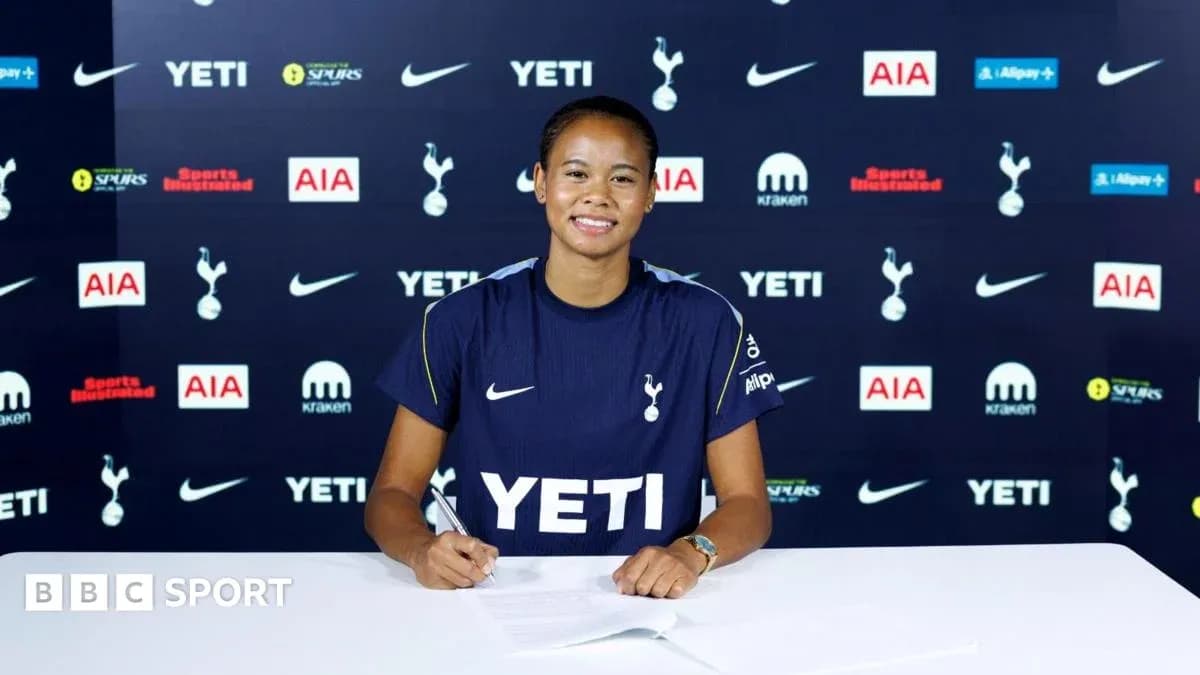 Player signing contract at Tottenham Hotspur announcement