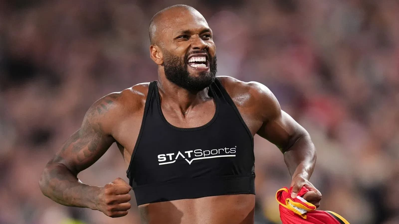 Athlete celebrating after a performance on the field Athlete celebrating after a performance on the field