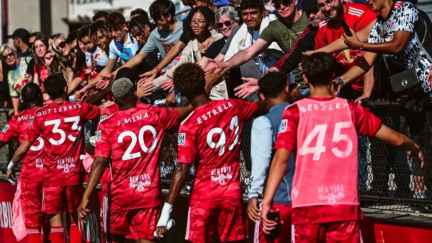 New York Red Bulls players celebrating with fans New York Red Bulls players celebrating with fans