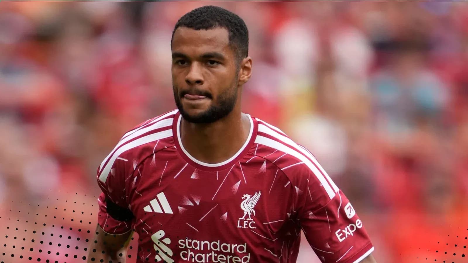 Player in Liverpool FC kit walking on the pitch Player in Liverpool FC kit walking on the pitch