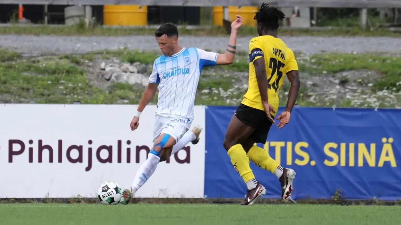 Universitatea Craiova player kicking the ball Universitatea Craiova player kicking the ball
