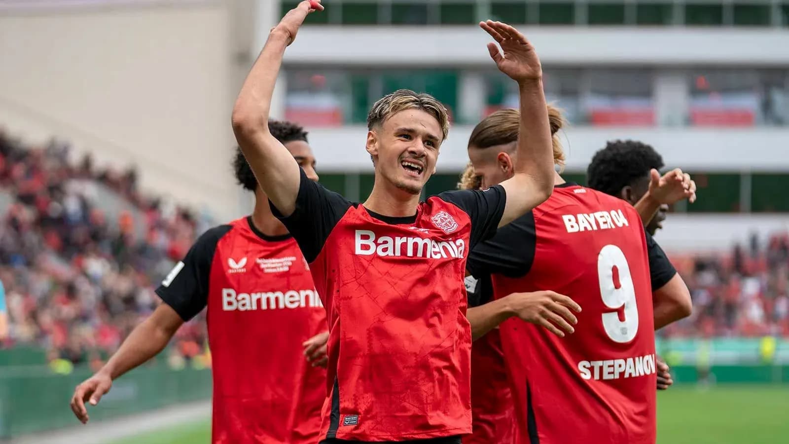 Player celebrating with teammates after scoring goal Player celebrating with teammates after scoring goal