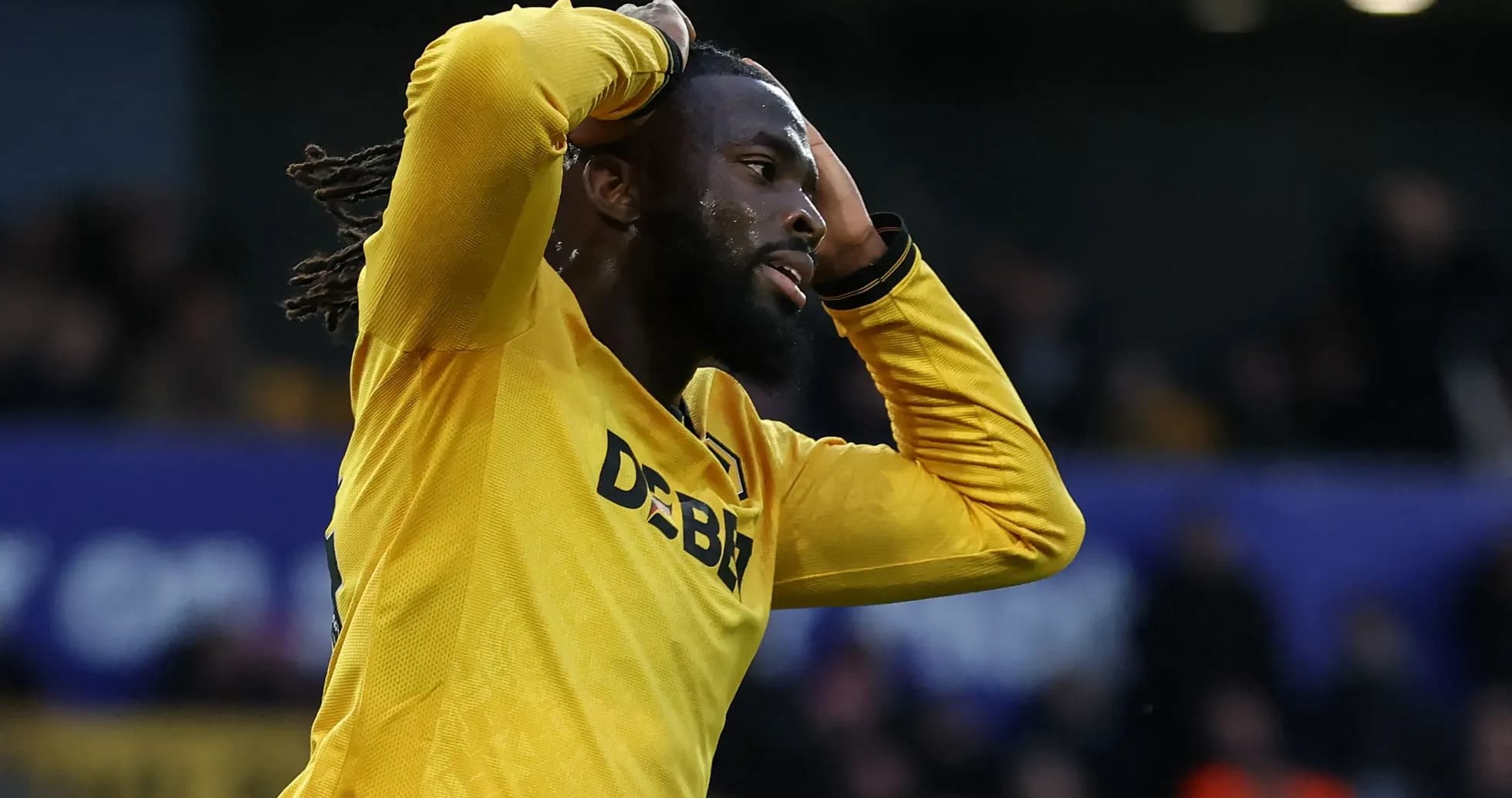 Player in yellow jersey expressing frustration during match Player in yellow jersey expressing frustration during match