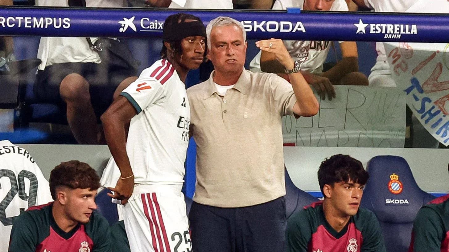 Coach instructing player on the sidelines during match Coach instructing player on the sidelines during match