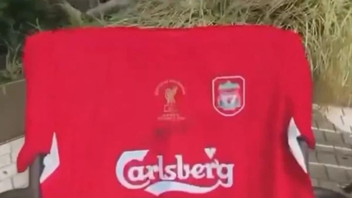 Red Liverpool jersey displayed outdoors Red Liverpool jersey displayed outdoors