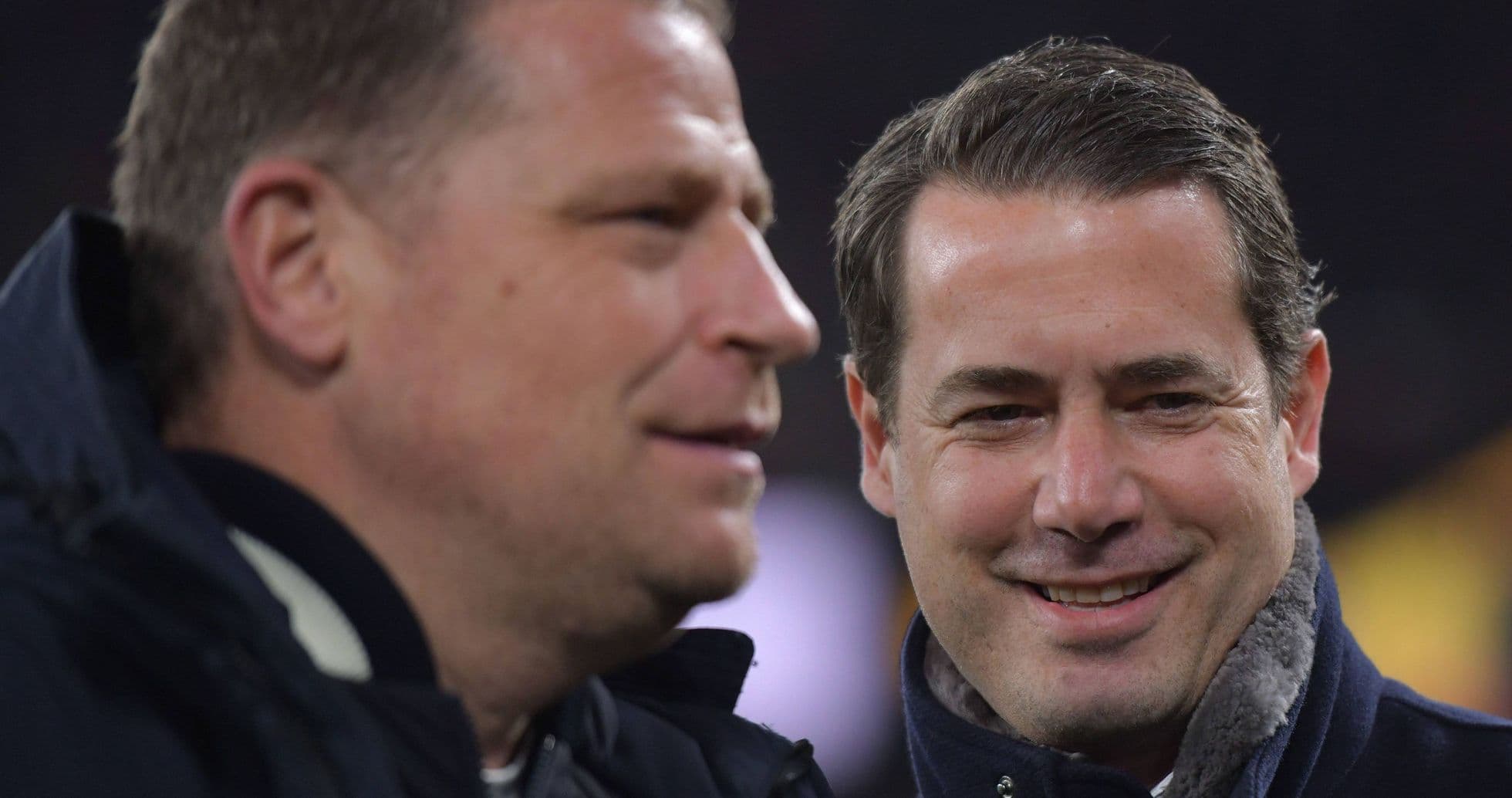Two men talking during a sports event Two men talking during a sports event