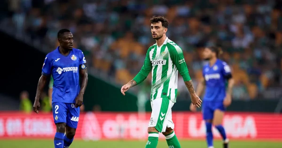 Two players on the field during a football match Two players on the field during a football match