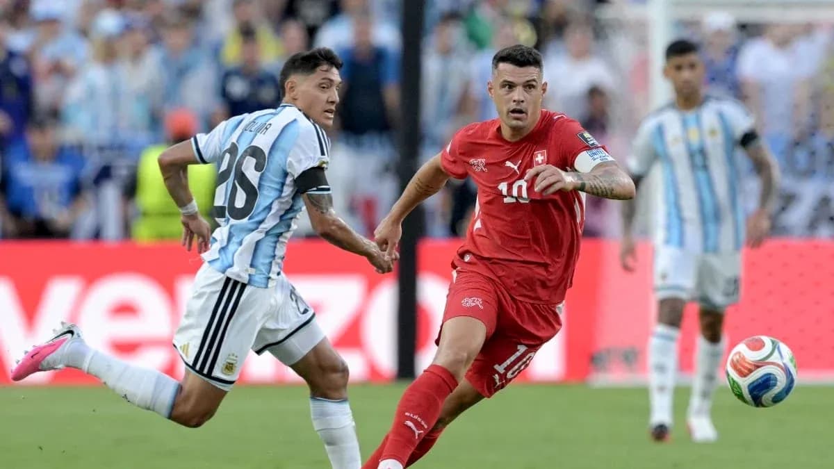 Argentina and Switzerland players competing for the ball Argentina and Switzerland players competing for the ball