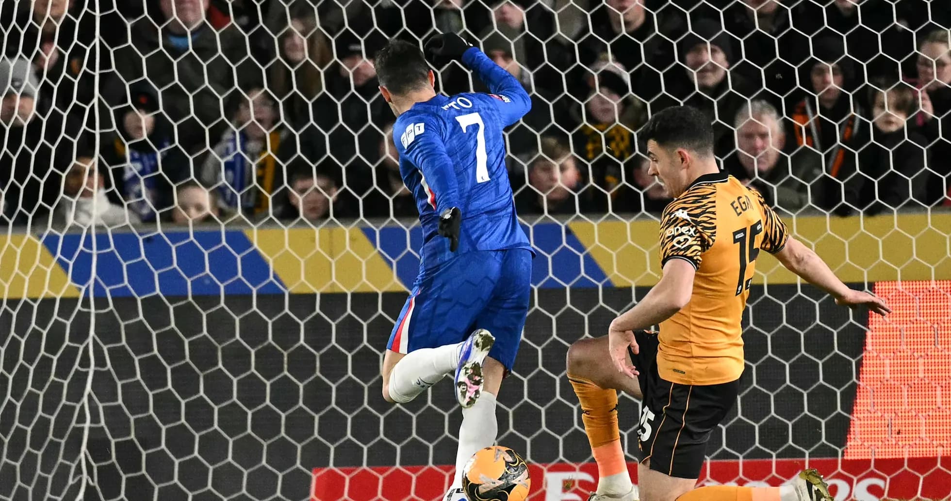 Chelsea player attempts to score against Hull City Chelsea player attempts to score against Hull City