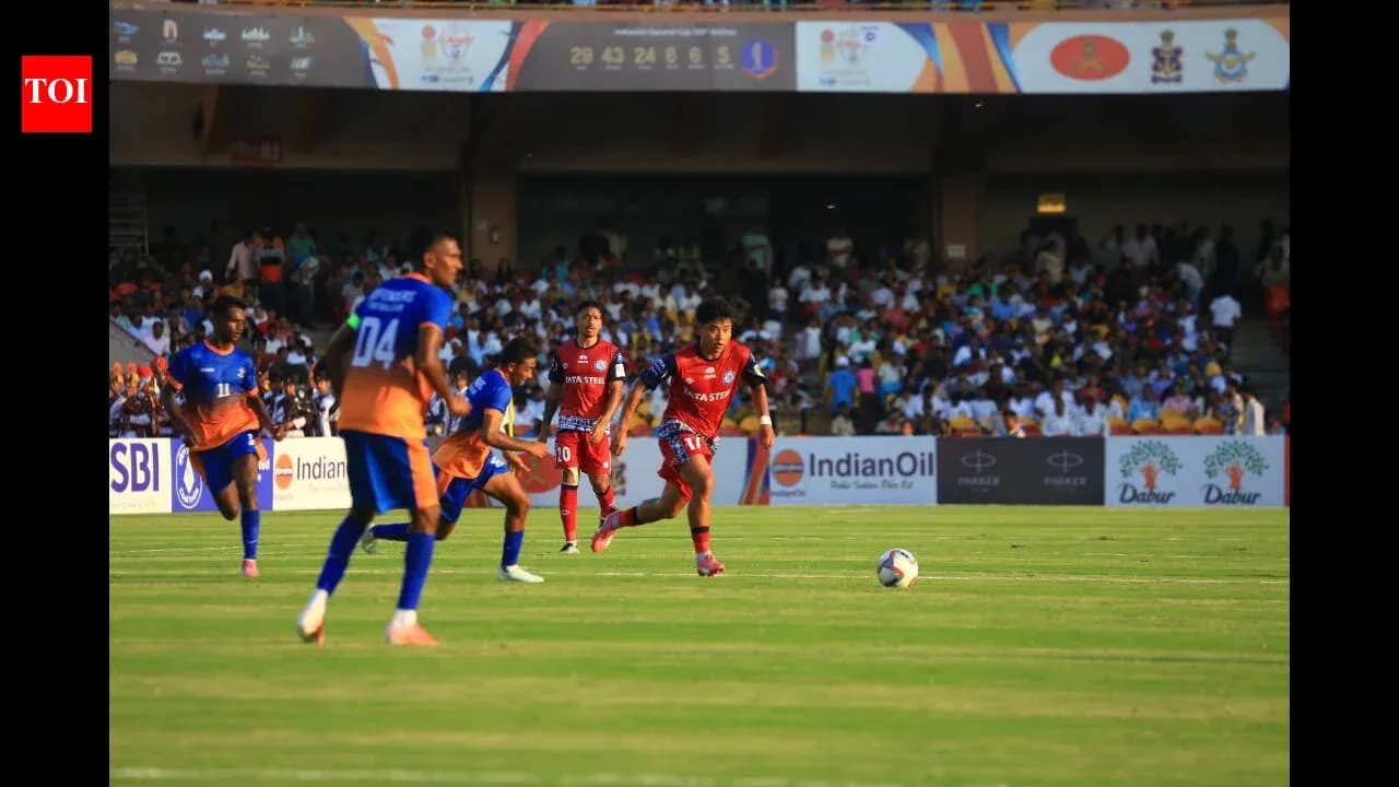 Players from two teams competing for the ball Players from two teams competing for the ball