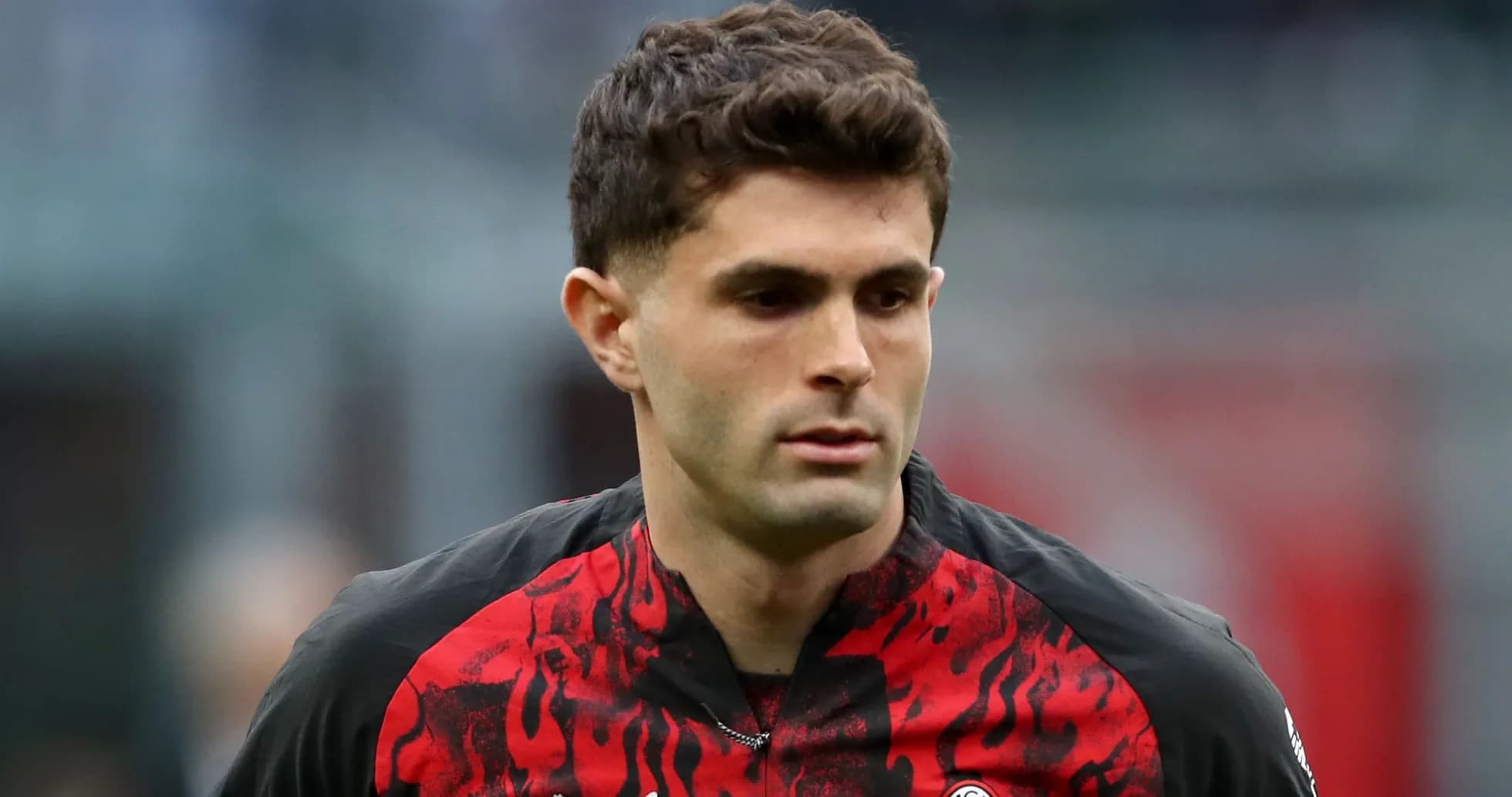 Player wearing AC Milan jersey during match Player wearing AC Milan jersey during match