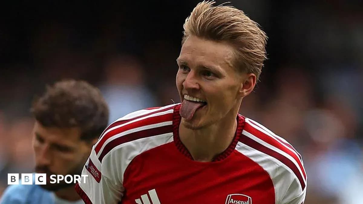 Arsenal player celebrating with tongue out during match Arsenal player celebrating with tongue out during match