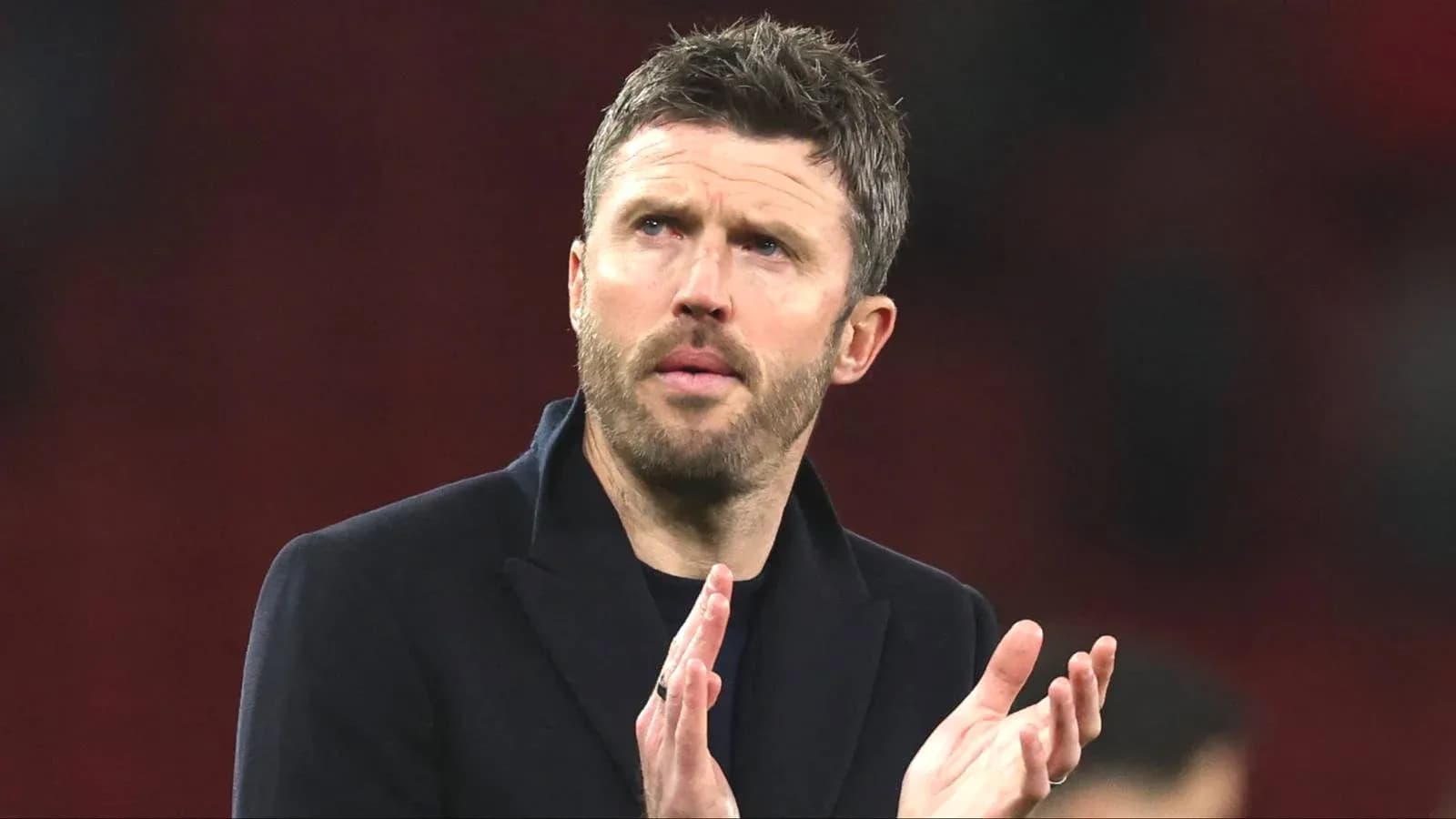 Coach applauding during a match or event Coach applauding during a match or event