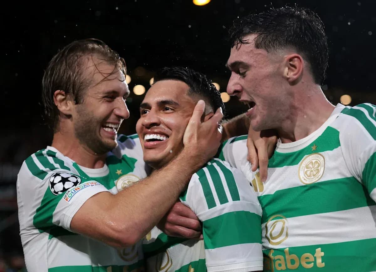 Celtic players celebrating a goal on the field Celtic players celebrating a goal on the field