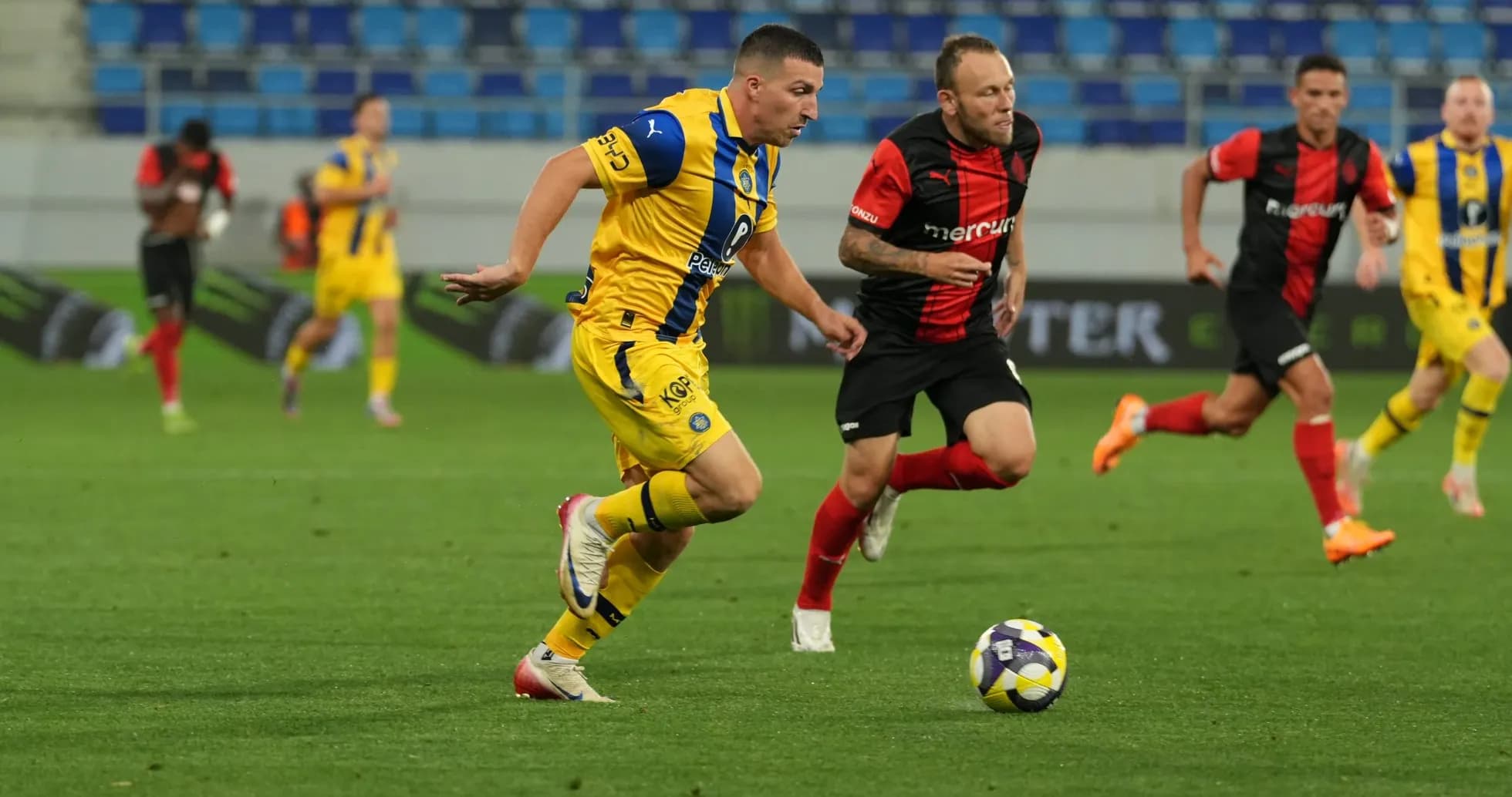 Maccabi Tel Aviv player dribbling the ball Maccabi Tel Aviv player dribbling the ball