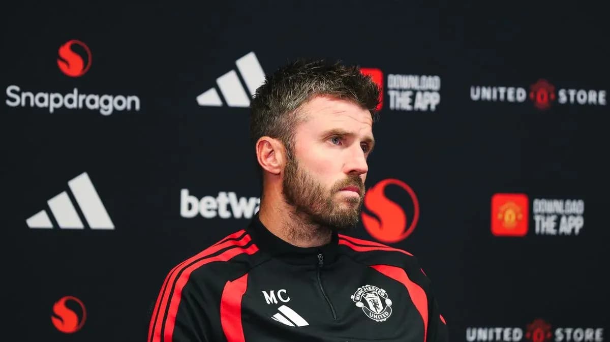Manager speaking at press conference with Manchester United branding Manager speaking at press conference with Manchester United branding