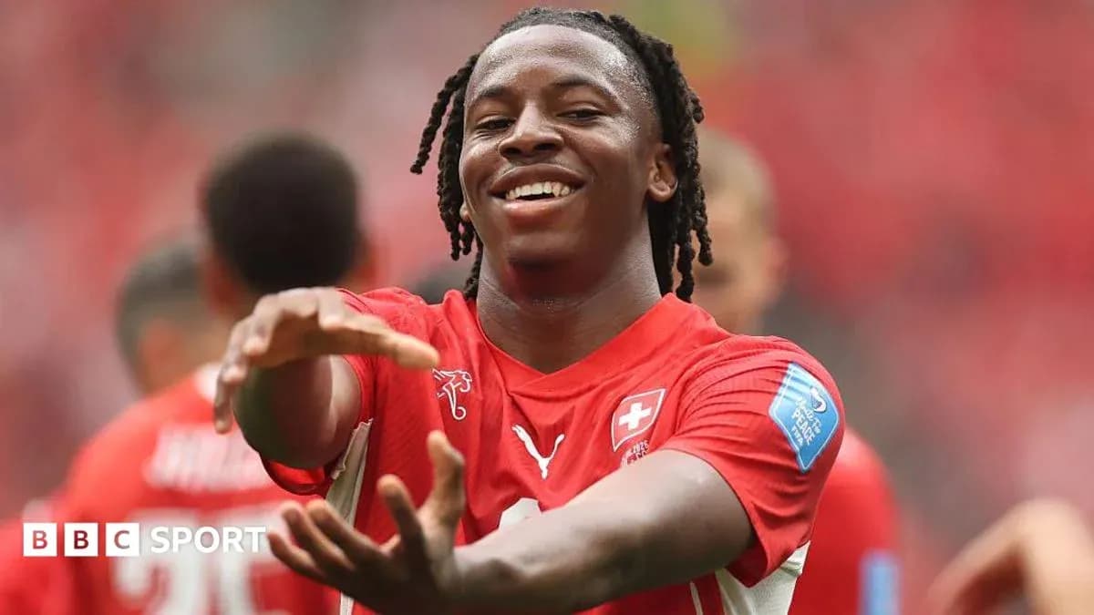 Player celebrating in red Swiss national team jersey Player celebrating in red Swiss national team jersey