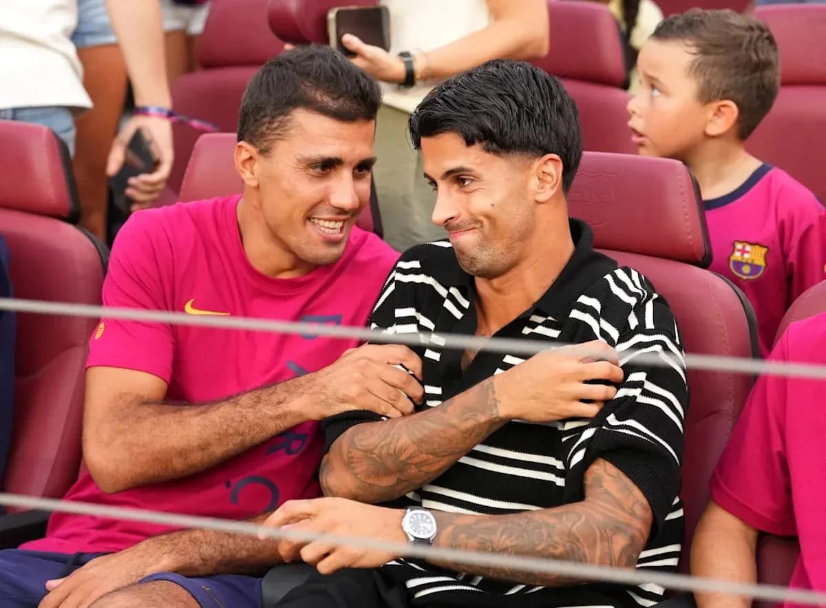 Two players seated together at a stadium Two players seated together at a stadium