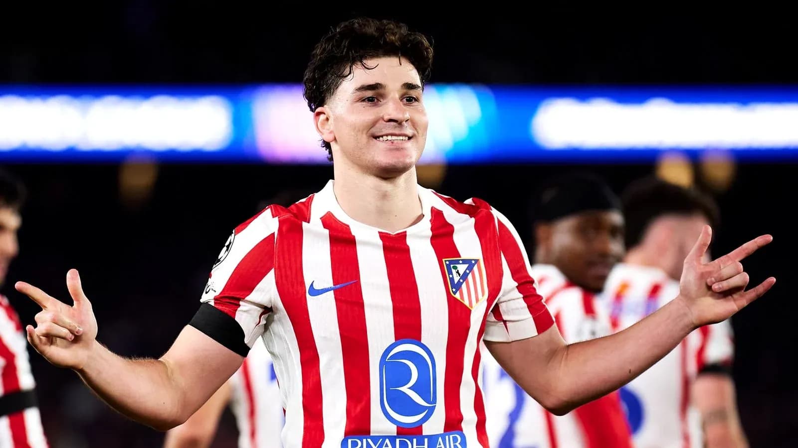 Player celebrating in Atletico Madrid jersey after match Player celebrating in Atletico Madrid jersey after match