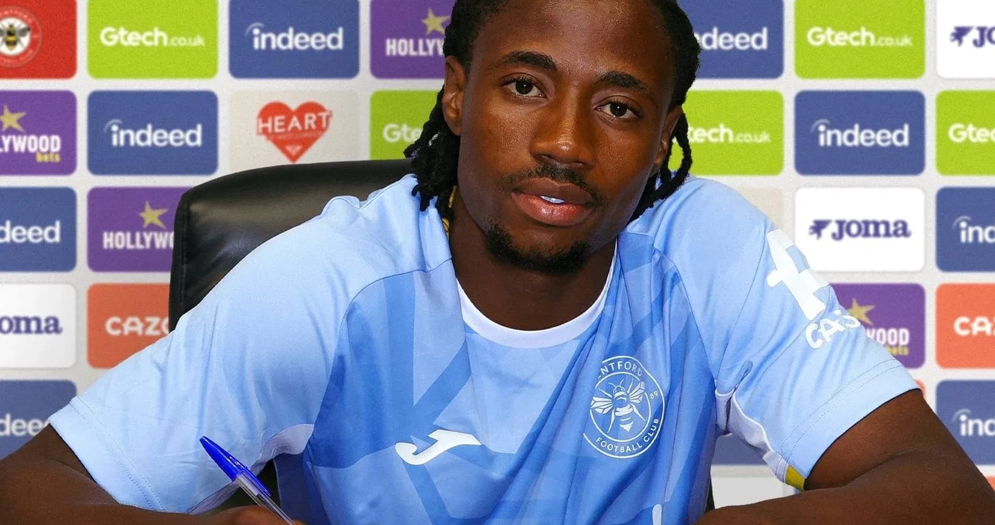 Player signing contract at press conference table Player signing contract at press conference table