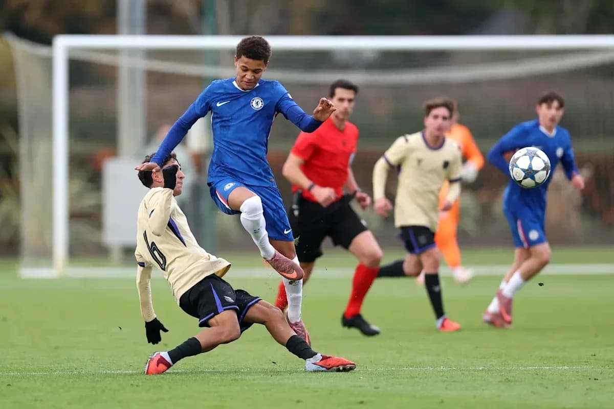 Player from Chelsea evading a tackle during match Player from Chelsea evading a tackle during match