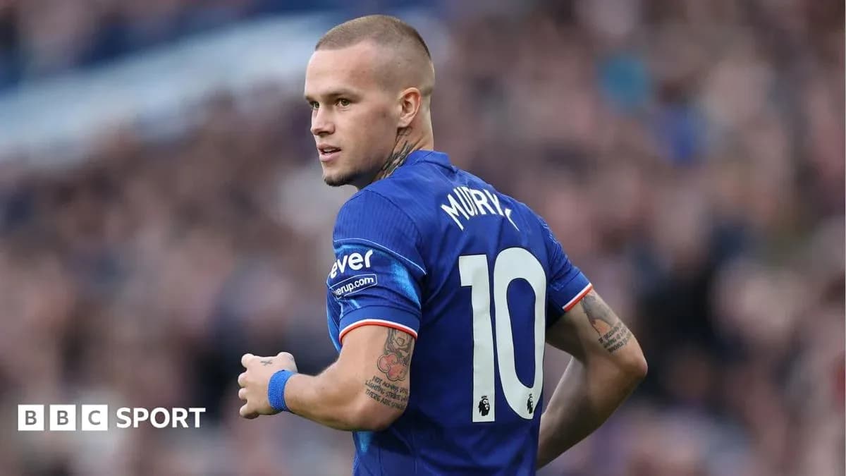 Player in blue jersey with number 10 turning away Player in blue jersey with number 10 turning away