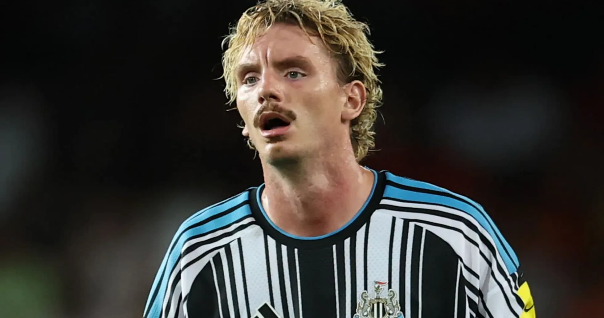 Newcastle United player in black and white jersey Newcastle United player in black and white jersey