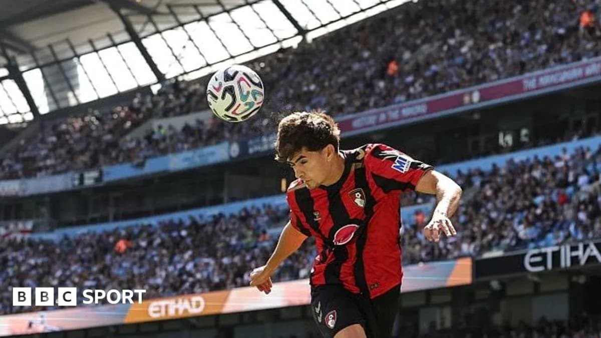 Bournemouth player heading the ball during match Bournemouth player heading the ball during match