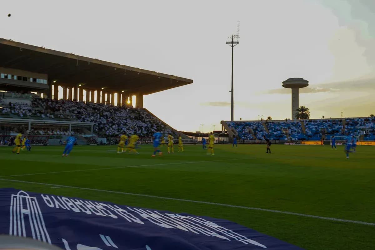 Players in blue and yellow during a soccer match Players in blue and yellow during a soccer match