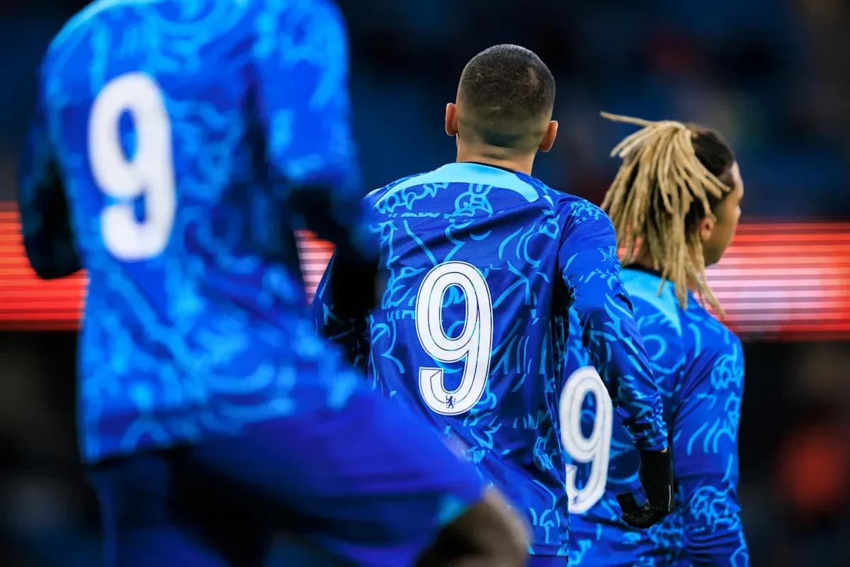 Players in blue jerseys with number 9 on back Players in blue jerseys with number 9 on back
