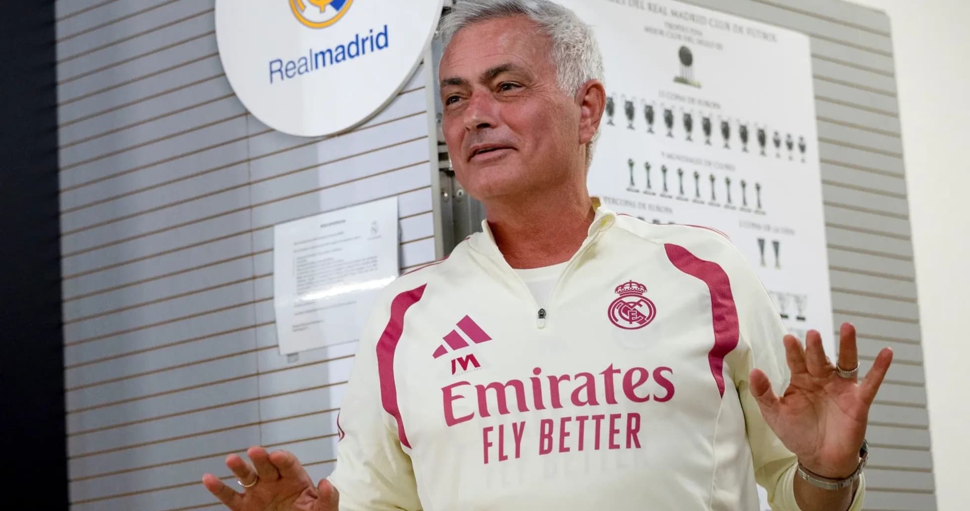 Coach speaking in front of Real Madrid logo Coach speaking in front of Real Madrid logo