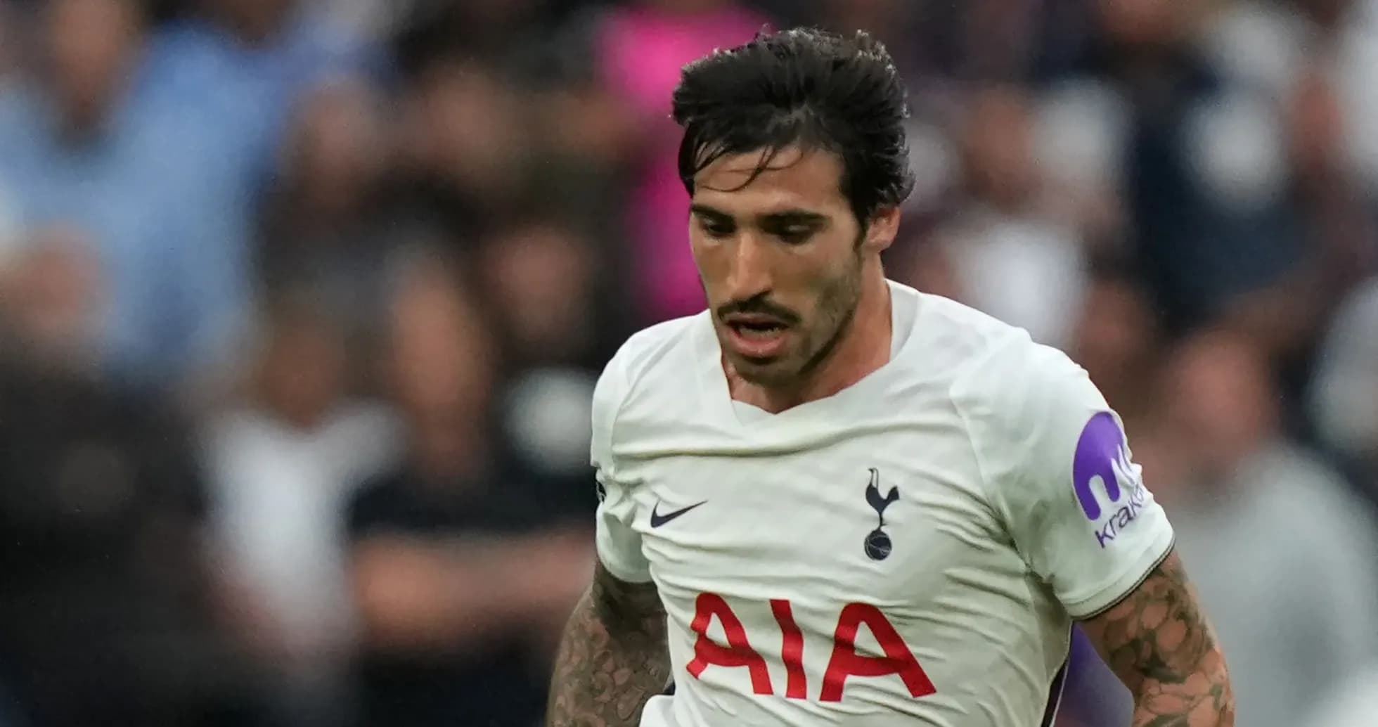 Player running with ball during match for Tottenham Player running with ball during match for Tottenham