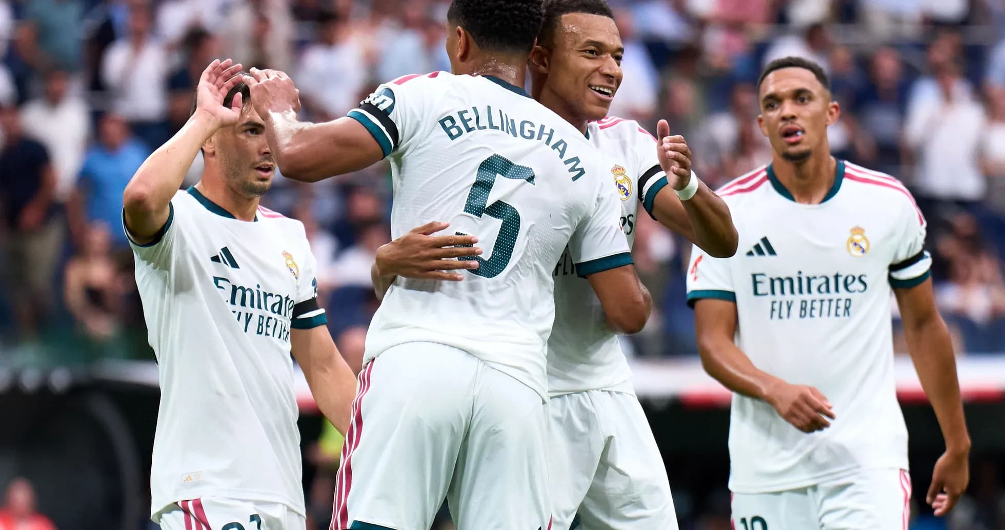 Real Madrid players celebrating a goal together Real Madrid players celebrating a goal together