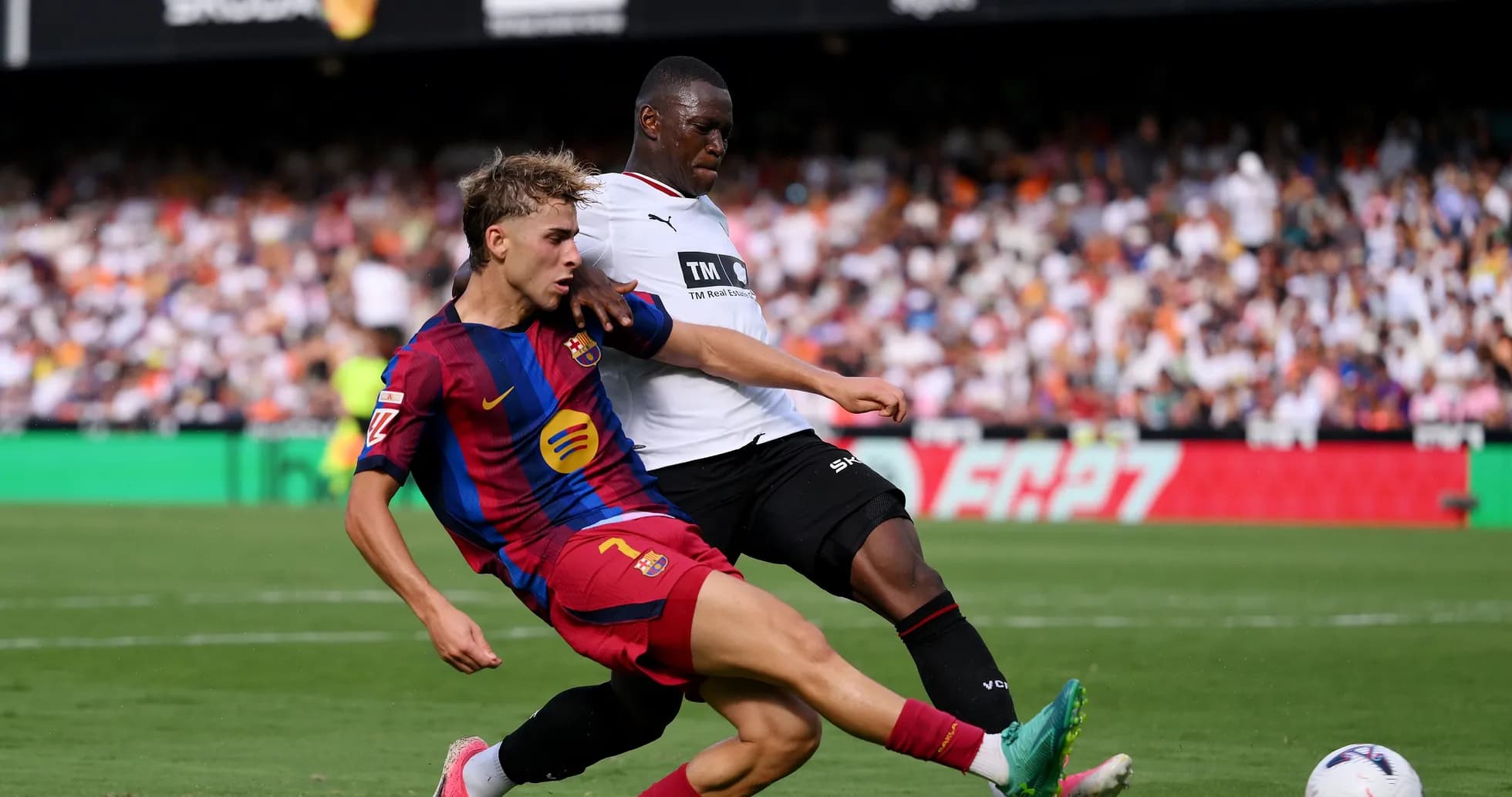 Player tackling opponent during a football match Player tackling opponent during a football match