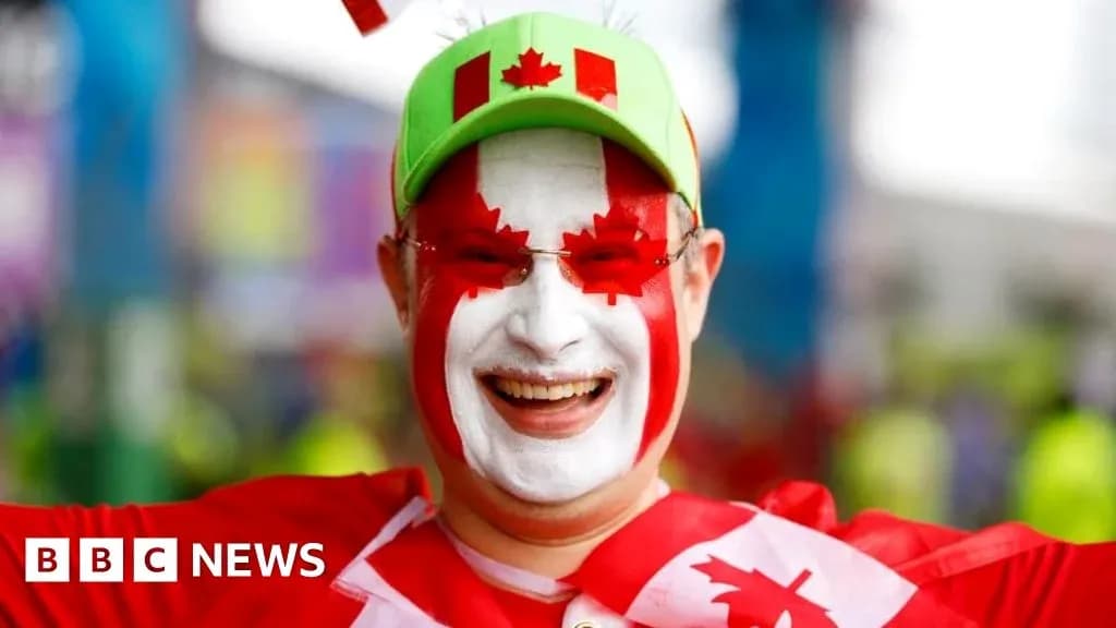 Fan celebrating with face paint and hat at event Fan celebrating with face paint and hat at event